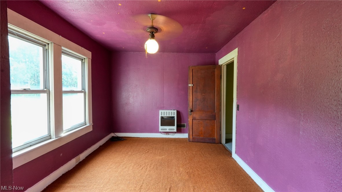 40862 Rado Ridge Road Caldwell, OH 43724 - Photo 17 of 35 Bedroom 3 featuring light carpet and a healthy amount of sunlight