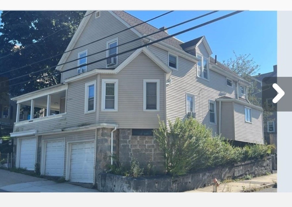 175 Middle Street, Unit 1 Fall River, MA 02724 - Photo 1 of 18 a view of a brick house with a yard