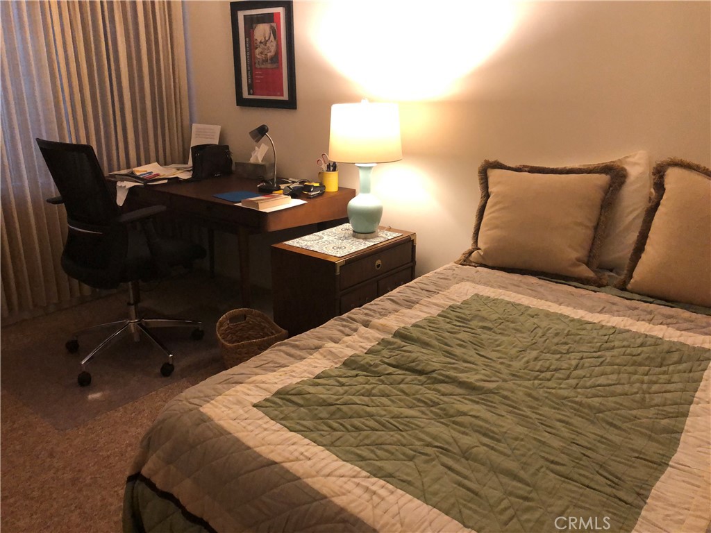 985 East California Boulevard Pasadena, CA 91106 - Photo 8 of 10 a bedroom with a bed and a desk