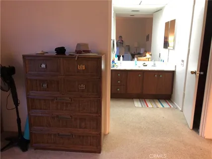a view of a patio with table and chairs potted plants