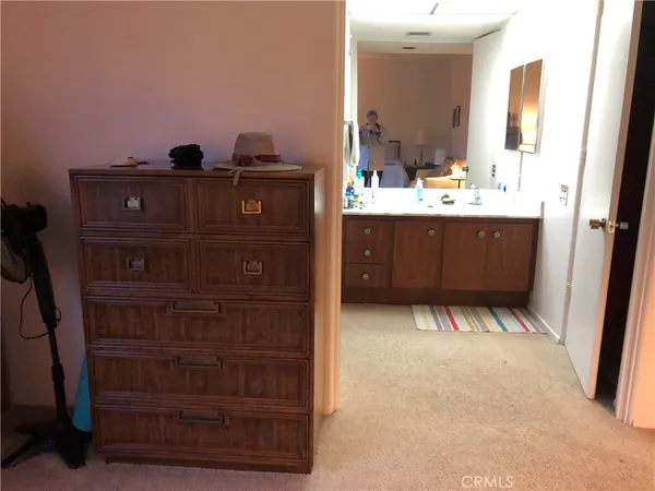 a view of a patio with table and chairs potted plants