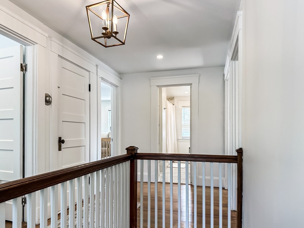 24 York Street Andover, MA 01810 - Photo 16 of 34 a view of a hallway with wooden floor