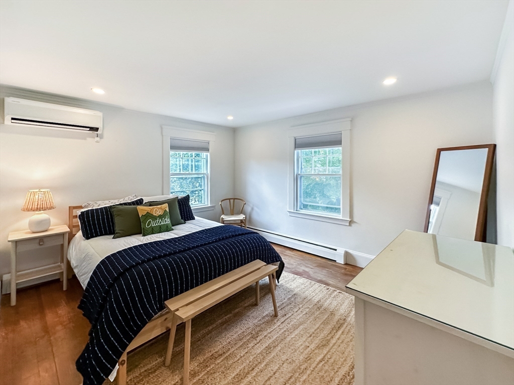24 York Street Andover, MA 01810 - Photo 21 of 34 a bedroom with a bed and wooden floor
