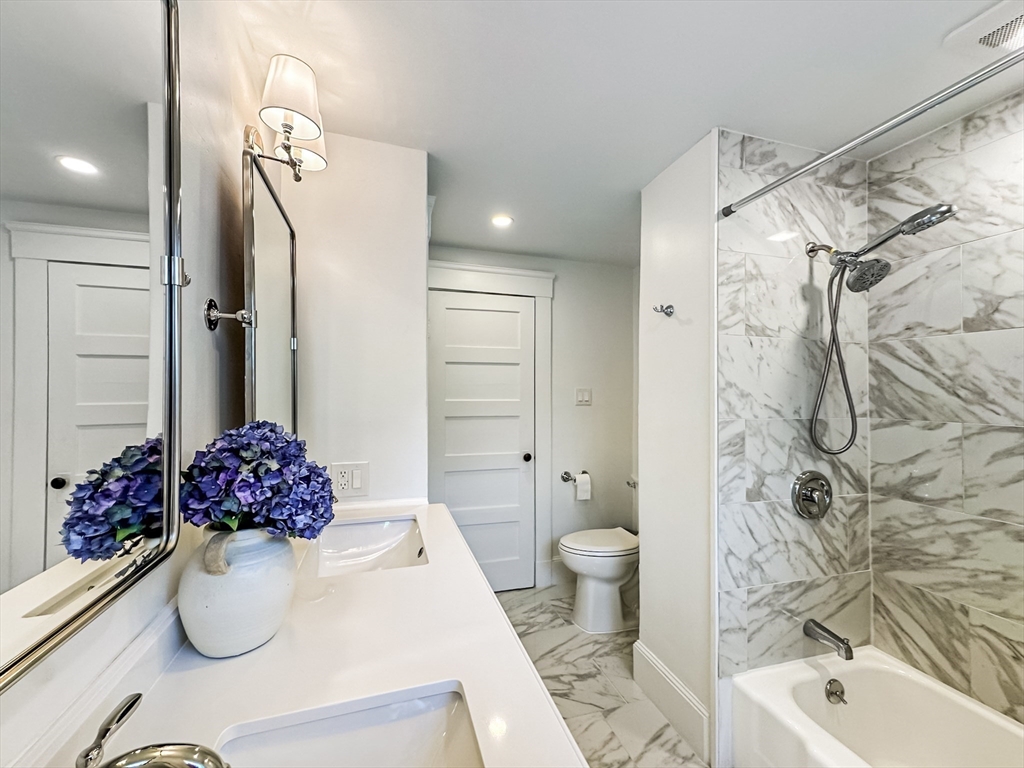 24 York Street Andover, MA 01810 - Photo 4 of 34 a bathroom with a sink toilet and shower