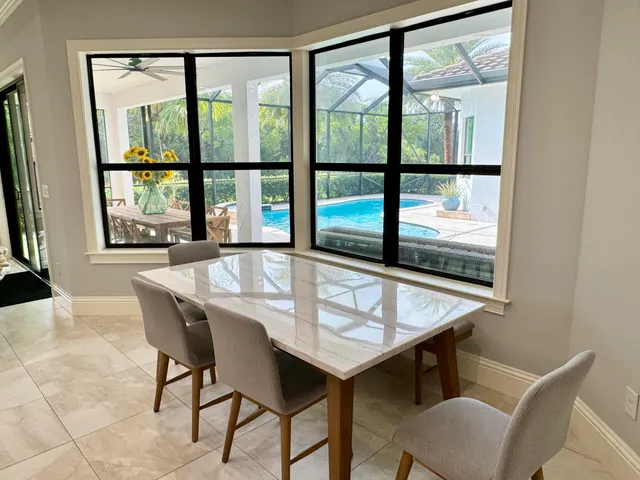 a dining room with furniture and window