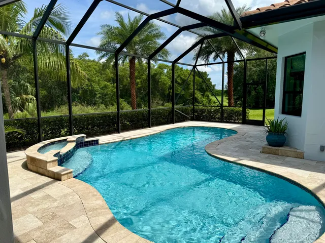 a view of a backyard with a sitting area