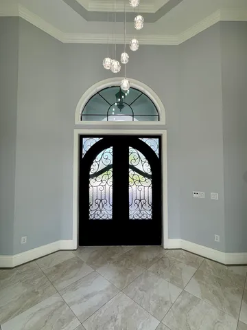 an empty room that has a window in it