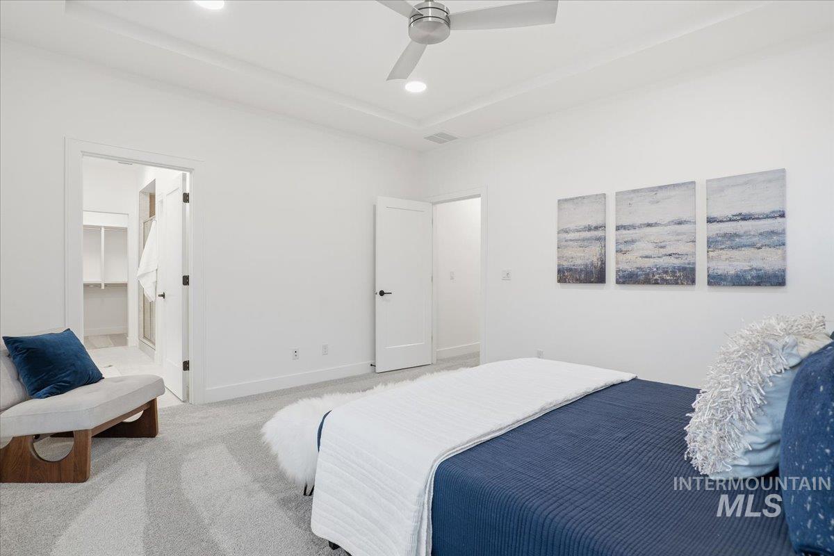 11701 North Rabbitbrush Way Boise, ID 83714 - Photo 23 of 33 Bedroom with ceiling fan, carpet flooring, a walk in closet, and recessed lighting