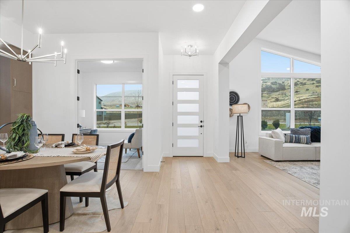 11701 North Rabbitbrush Way Boise, ID 83714 - Photo 3 of 33 Foyer with a chandelier, light wood-type flooring, and recessed lighting