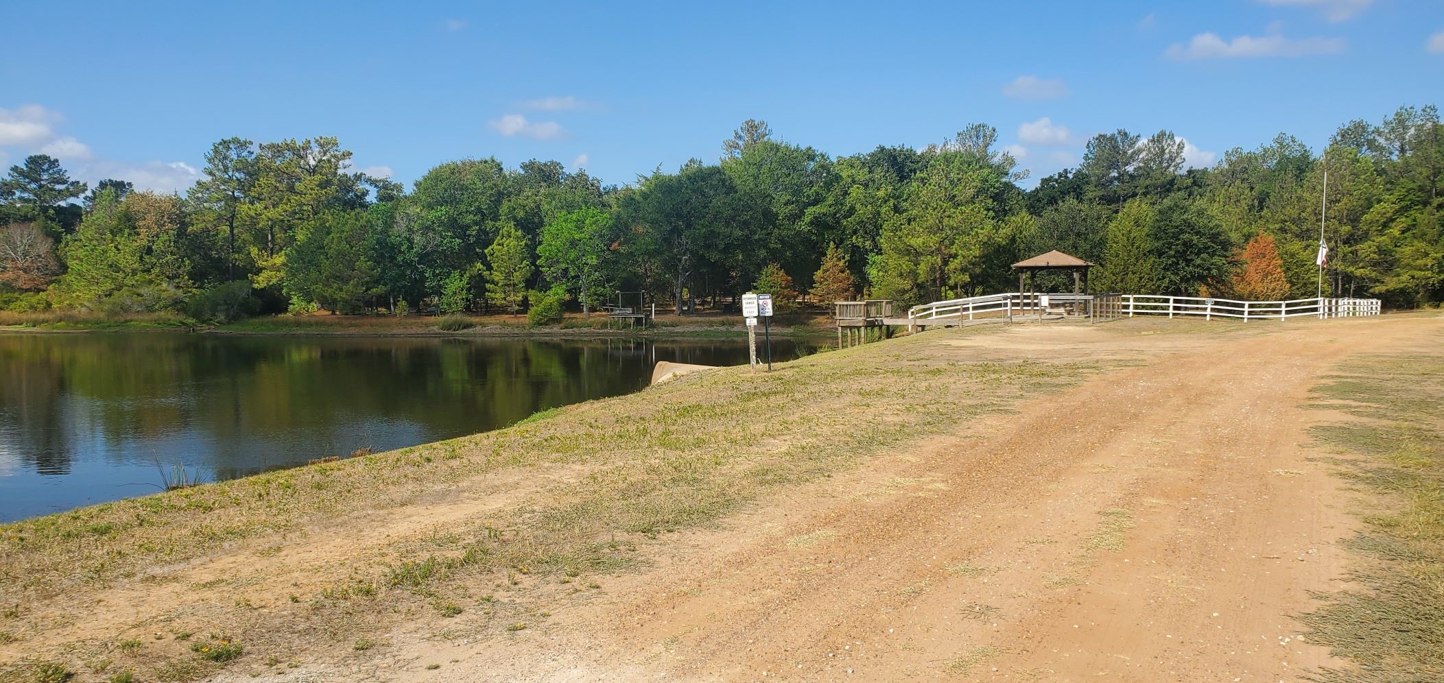 29044 Red Fox Drive Hempstead, TX 77445 - Photo 9 of 27 a view of a lake with a house in the background