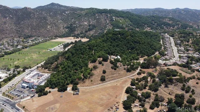 an aerial view of a house with yard