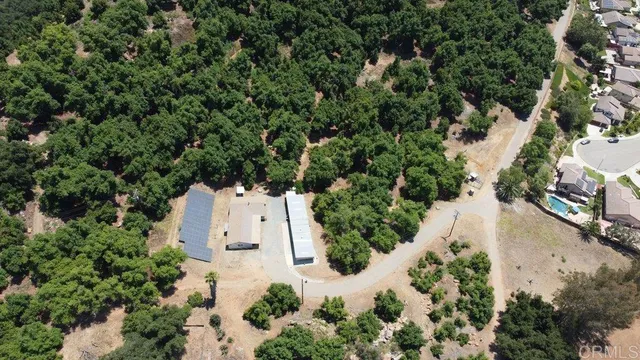 an aerial view of a house with outdoor space and street view