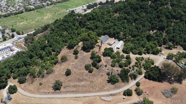 an aerial view of city sand dunes and trees
