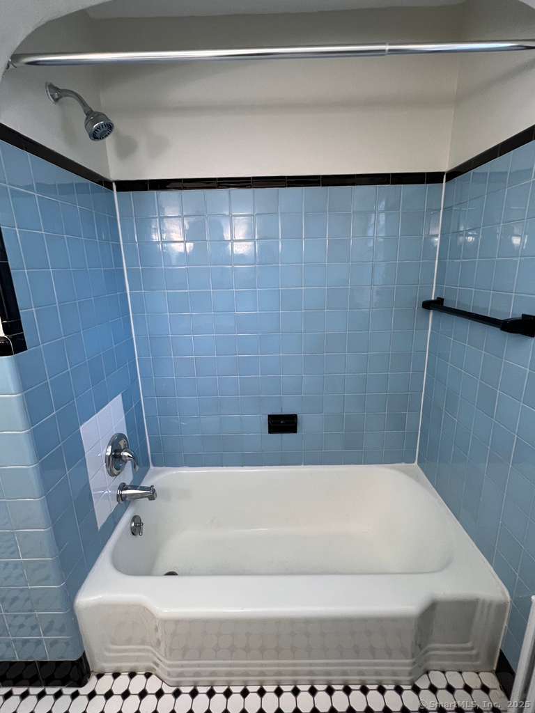 109 Alfred Street Bridgeport, CT 06605 - Photo 17 of 22 a bathroom with a bathtub
