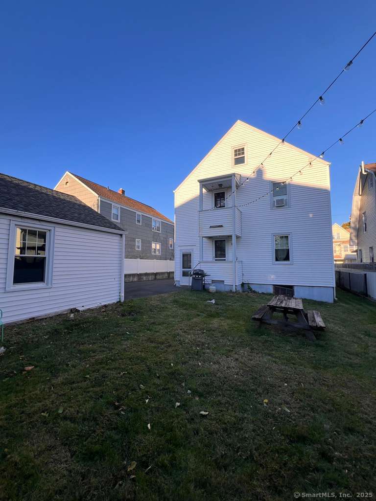 109 Alfred Street Bridgeport, CT 06605 - Photo 3 of 22 a backyard of a house with lots of green space