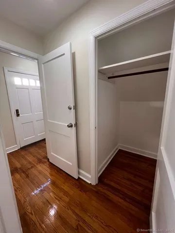 an empty room with wooden floor