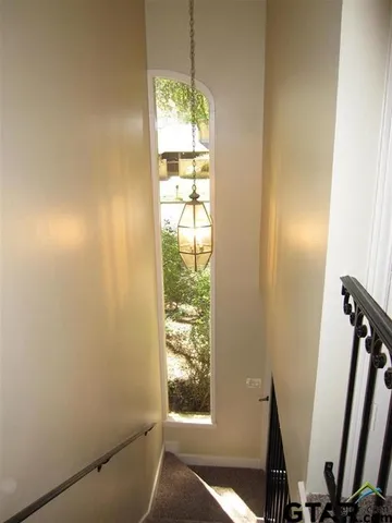 a view of an empty room with windows