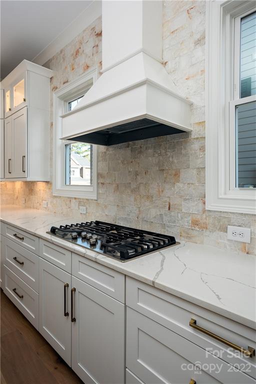 811 Naples Drive Davidson, NC 28036 - Photo 11 of 31 a kitchen with white cabinets and appliances
