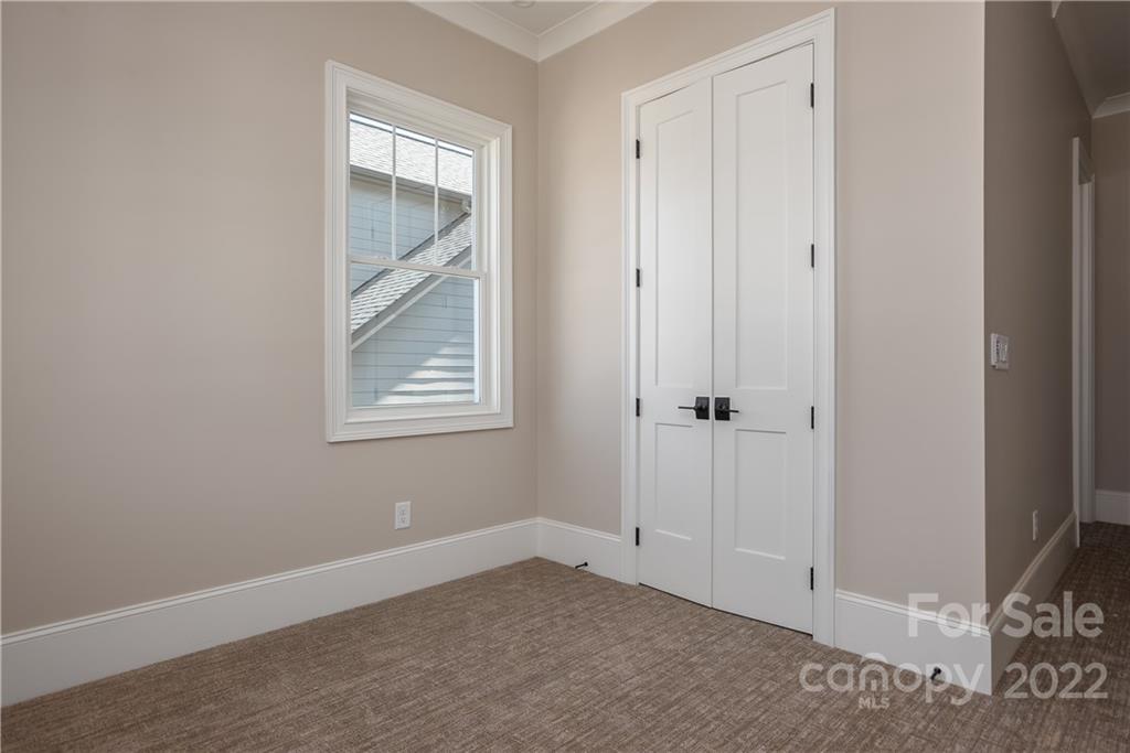 811 Naples Drive Davidson, NC 28036 - Photo 20 of 31 an empty room with windows