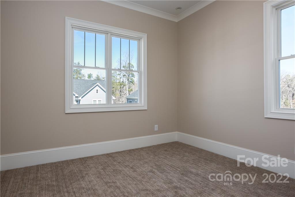 811 Naples Drive Davidson, NC 28036 - Photo 26 of 31 an empty room with windows