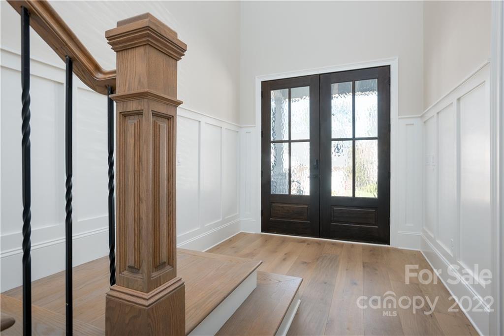 811 Naples Drive Davidson, NC 28036 - Photo 4 of 31 a view of front door with wooden floor