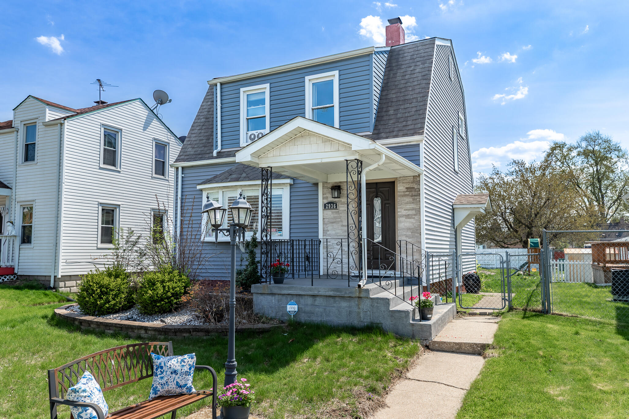 2936 Janet Place Hammond, IN 46323 - Photo 2 of 28 a front view of a house with garden