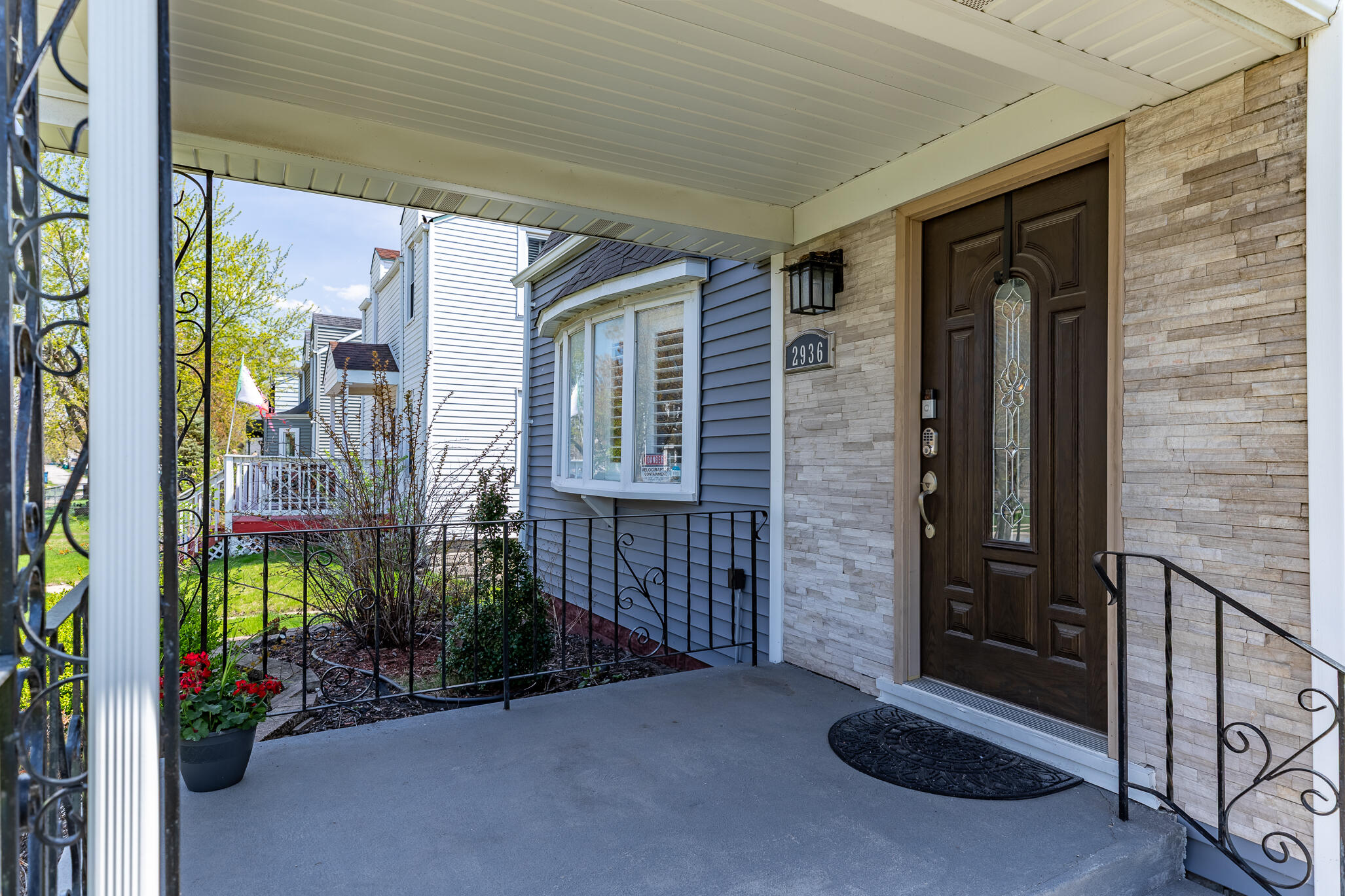 2936 Janet Place Hammond, IN 46323 - Photo 5 of 28 a view of a house with a potted plant and floor to ceiling window