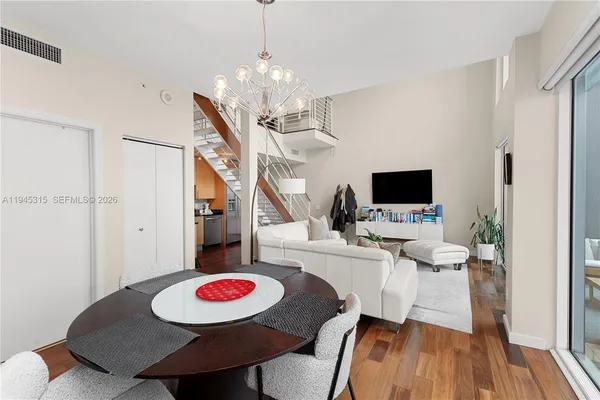 a very nice looking dining room with a table and chairs