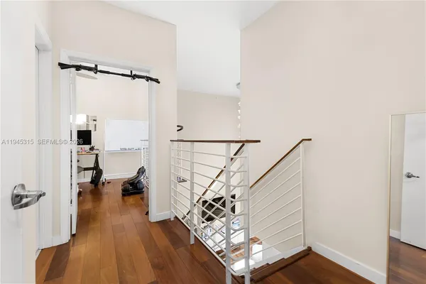 a view of entryway with wooden floor