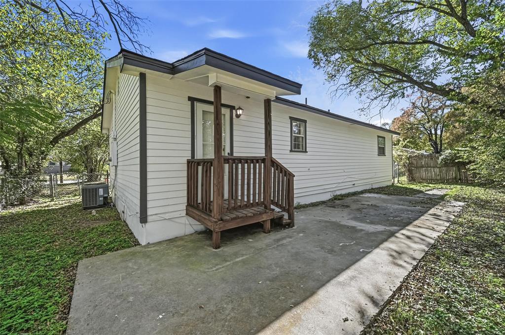 704 Graham Street Cleburne, TX 76033 - Photo 17 of 18 a view of a house with a yard