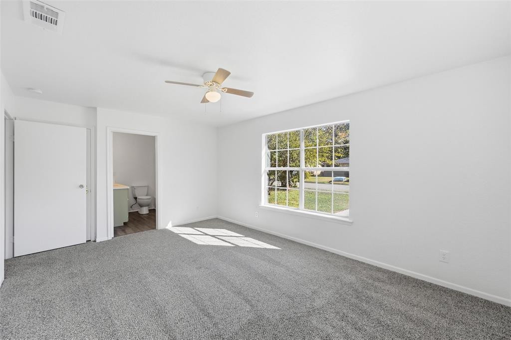 704 Graham Street Cleburne, TX 76033 - Photo 9 of 18 a view of an empty room with a window