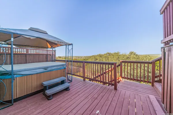 a view of outdoor space with deck and flat screen tv