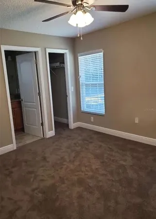 an empty room with windows and entrance