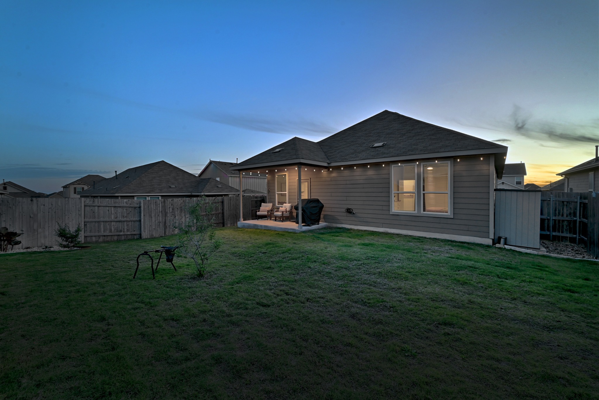 462 Tree Nut Loop Buda, TX 78610 - Photo 25 of 38 There is enough green space here to add a garden, a playscape, or an additional patio extension.