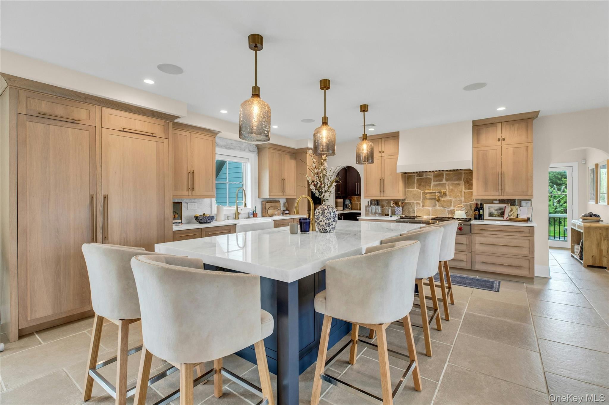 52 Concourse East Brightwaters, NY 11718 - Photo 18 of 49 a large kitchen with a table and chairs