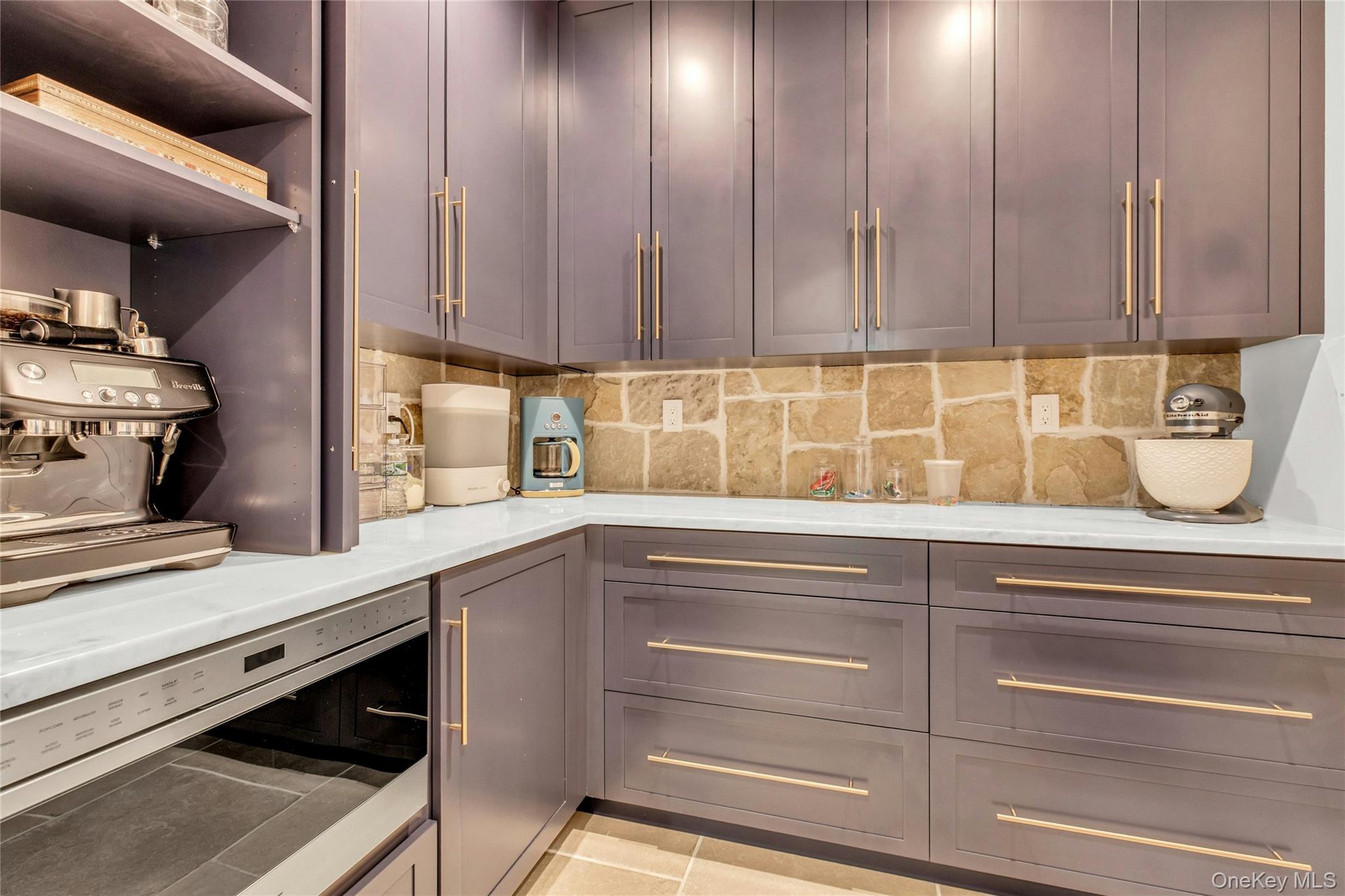 52 Concourse East Brightwaters, NY 11718 - Photo 20 of 49 a kitchen with a sink and cabinets