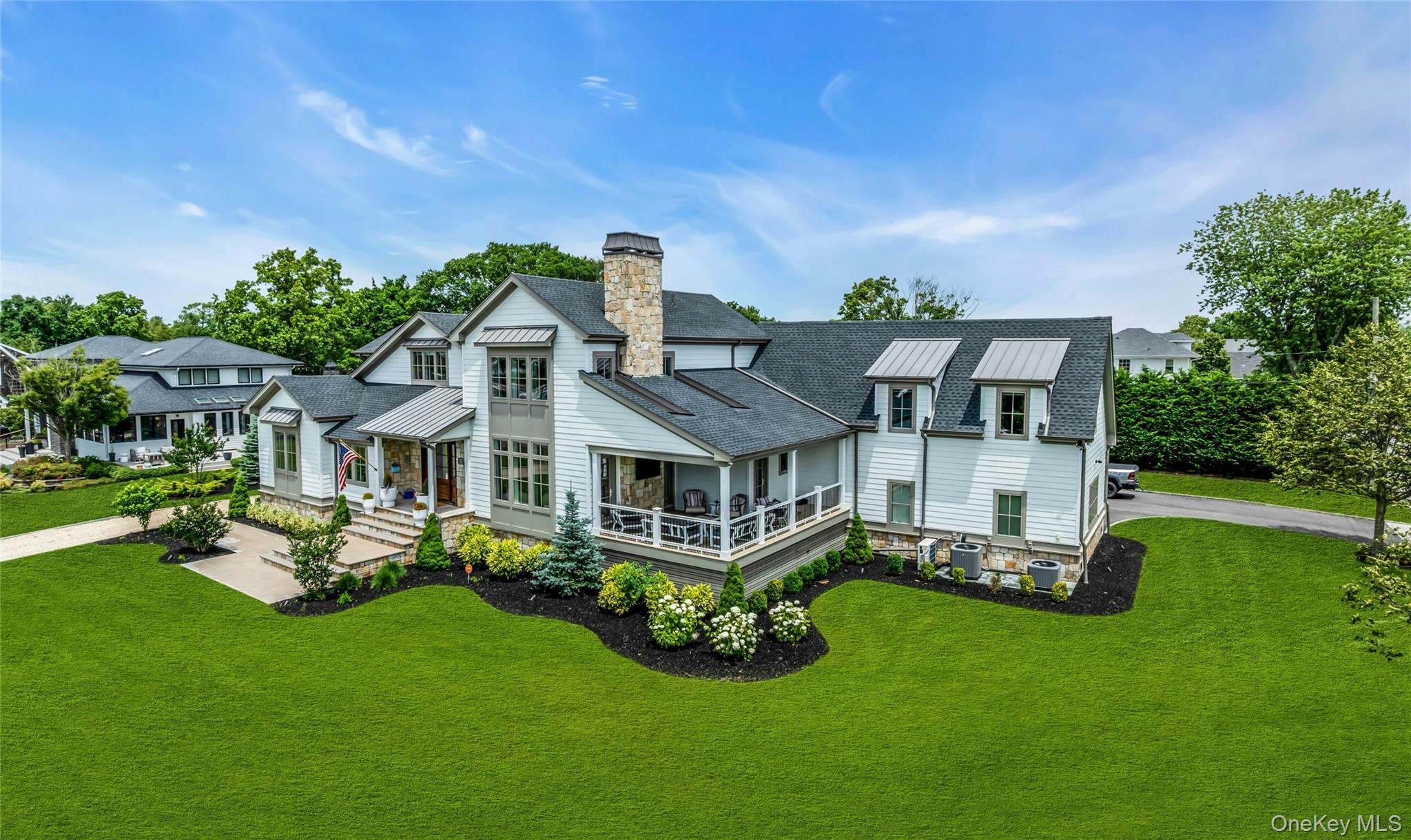 52 Concourse East Brightwaters, NY 11718 - Photo 2 of 49 a front view of a house with garden