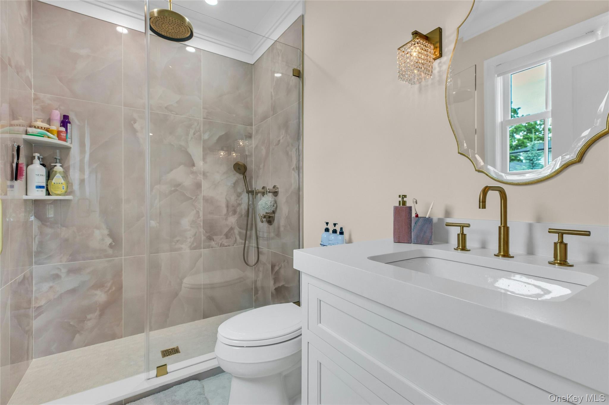 52 Concourse East Brightwaters, NY 11718 - Photo 24 of 49 a bathroom with a sink a toilet and a shower