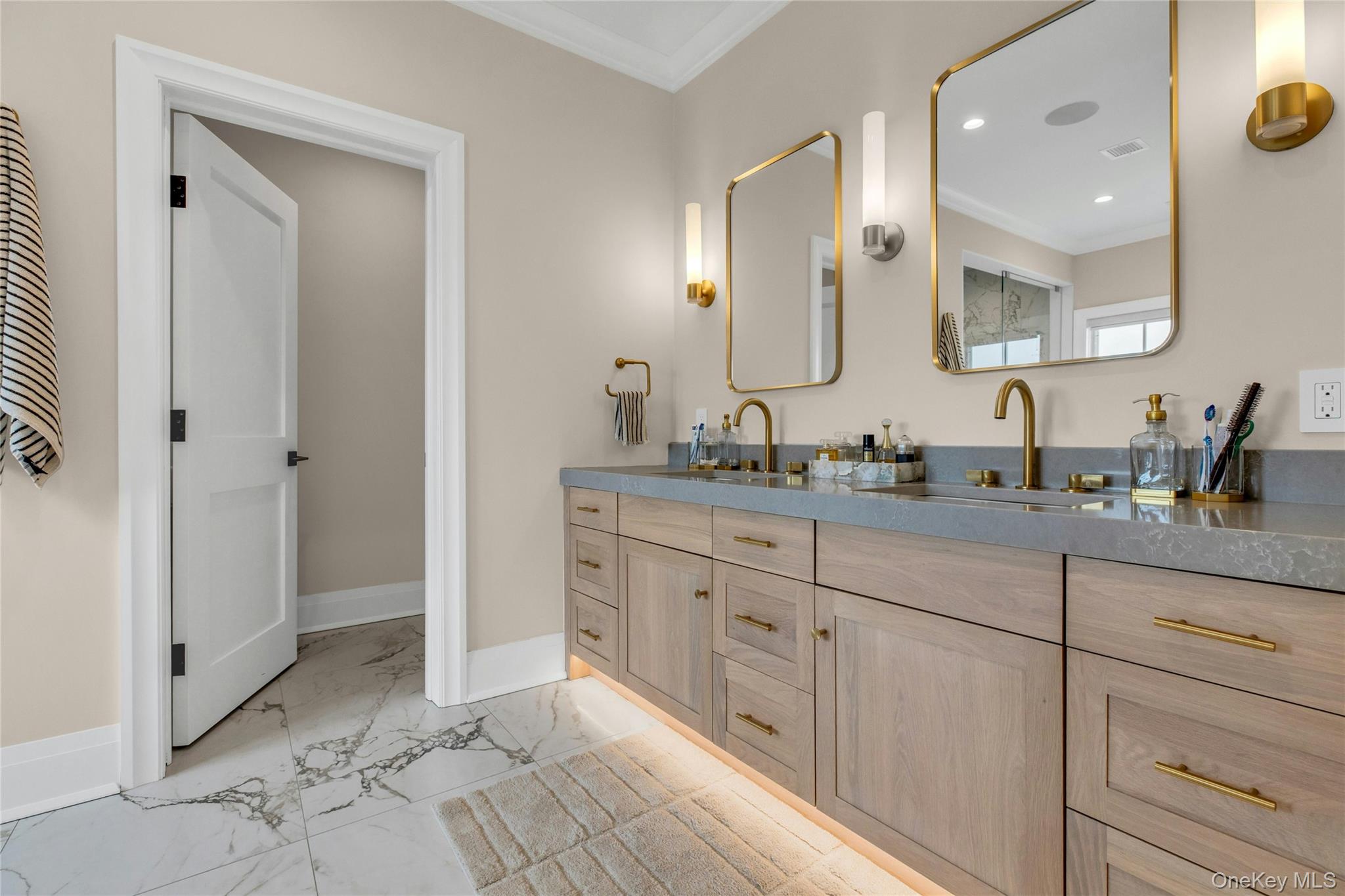 52 Concourse East Brightwaters, NY 11718 - Photo 28 of 49 a spacious bathroom with double sink and a mirror