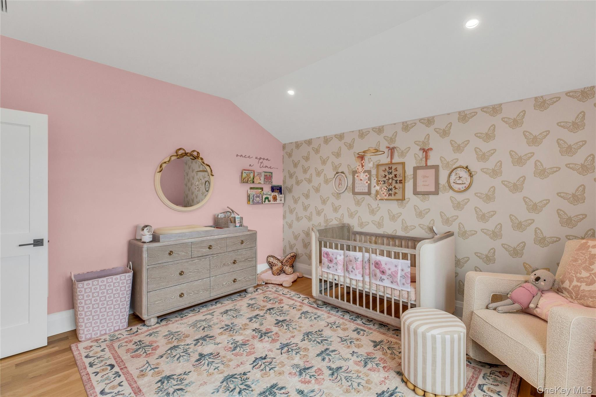 52 Concourse East Brightwaters, NY 11718 - Photo 34 of 49 a bedroom with a baby bed a couch and dresser