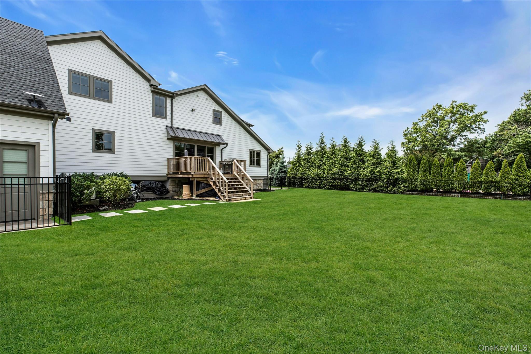 52 Concourse East Brightwaters, NY 11718 - Photo 40 of 49 a view of a house with backyard and garden