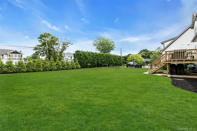 a view of a house with a yard and plants