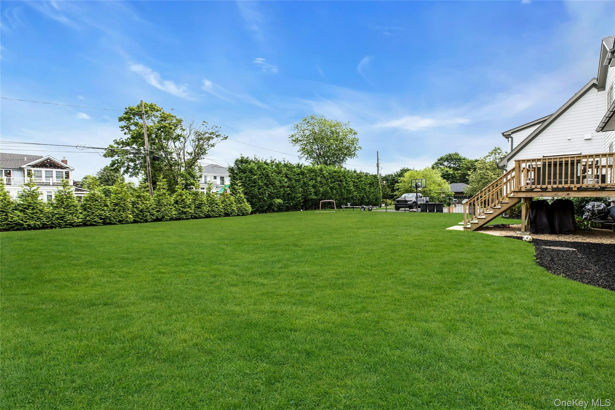 52 Concourse East Brightwaters, NY 11718 - Photo 41 of 49 a view of a house with a big yard