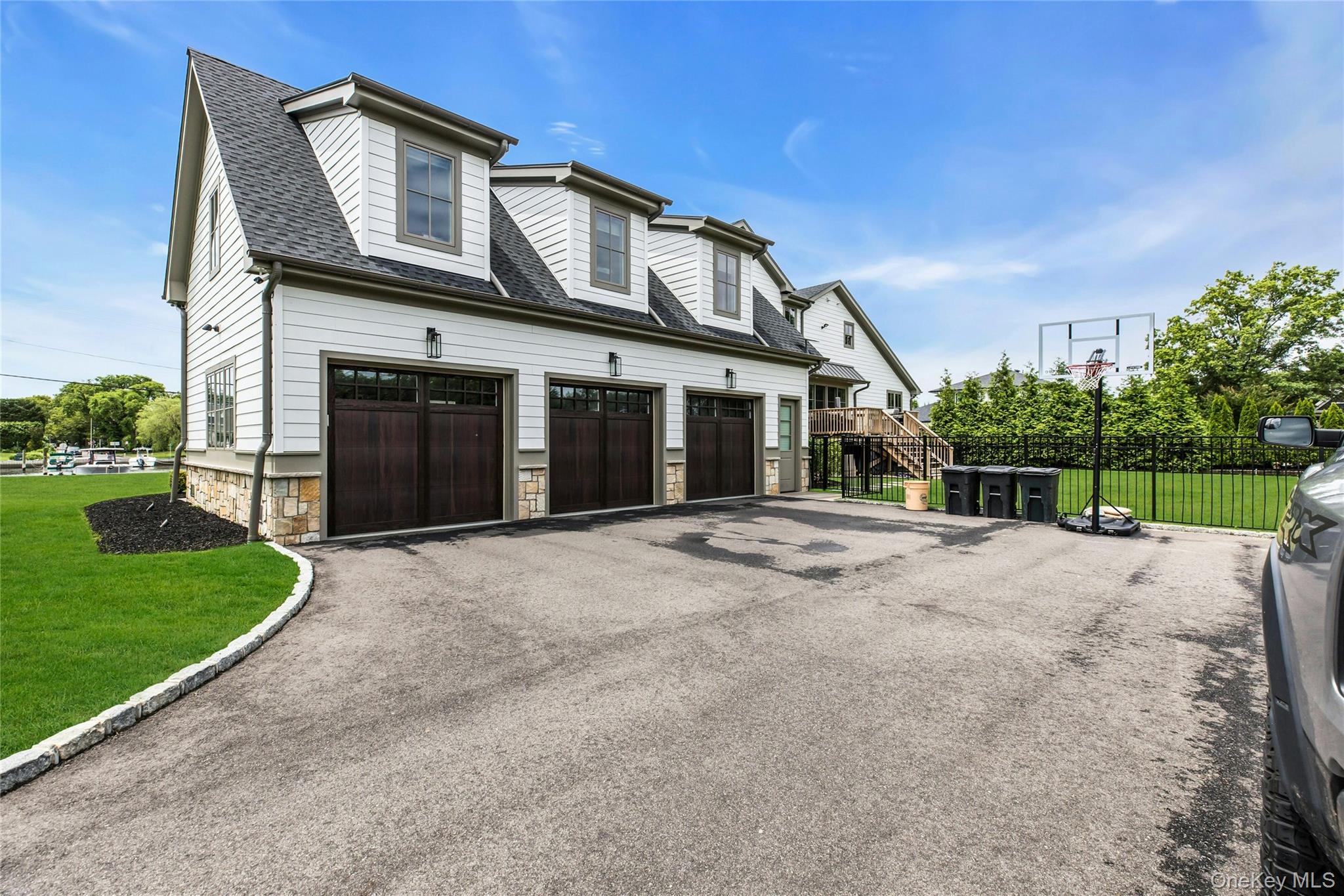 52 Concourse East Brightwaters, NY 11718 - Photo 43 of 49 a view of a house with a yard and plants