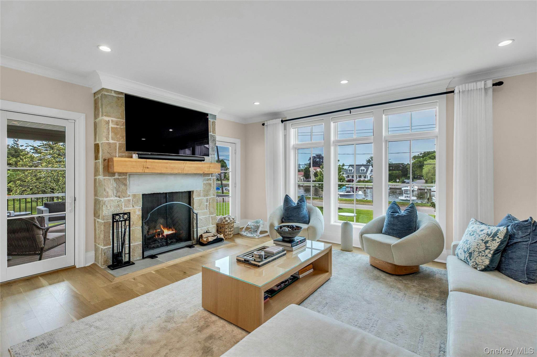 52 Concourse East Brightwaters, NY 11718 - Photo 5 of 49 a living room with furniture and a fireplace