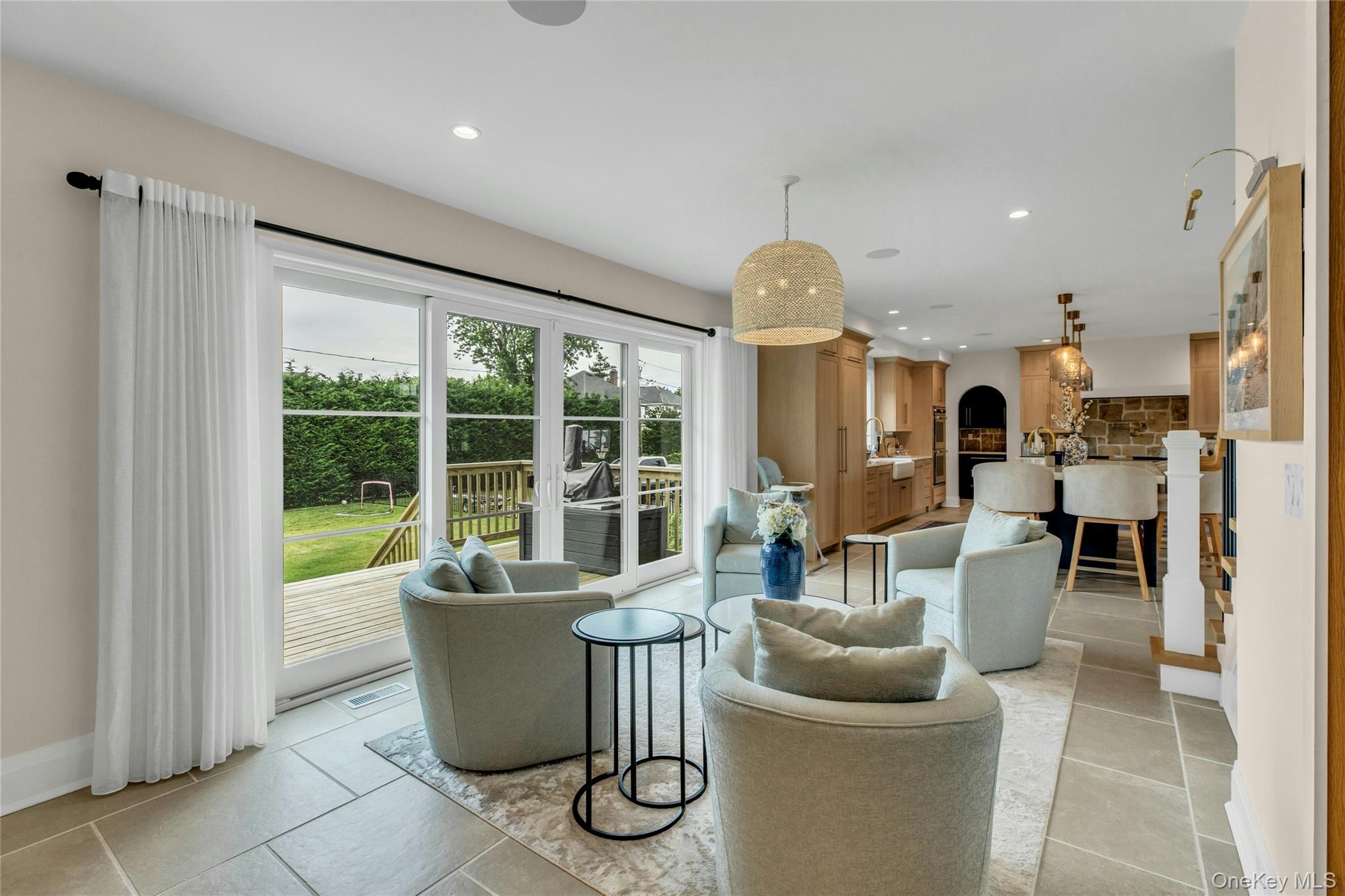52 Concourse East Brightwaters, NY 11718 - Photo 8 of 49 a dining room with furniture and a large window