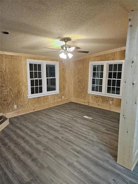 3600 Grady Smith Road Loganville, GA 30052 - Photo 11 of 20 a view of an empty room with wooden floor and a window