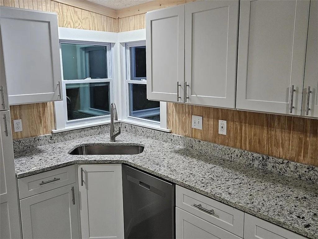 3600 Grady Smith Road Loganville, GA 30052 - Photo 2 of 20 a kitchen with granite countertop a sink and cabinets