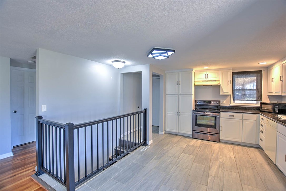 3970 Mount Zion Road Decatur, IL 62521 - Photo 13 of 36 a view of a kitchen from a hallway