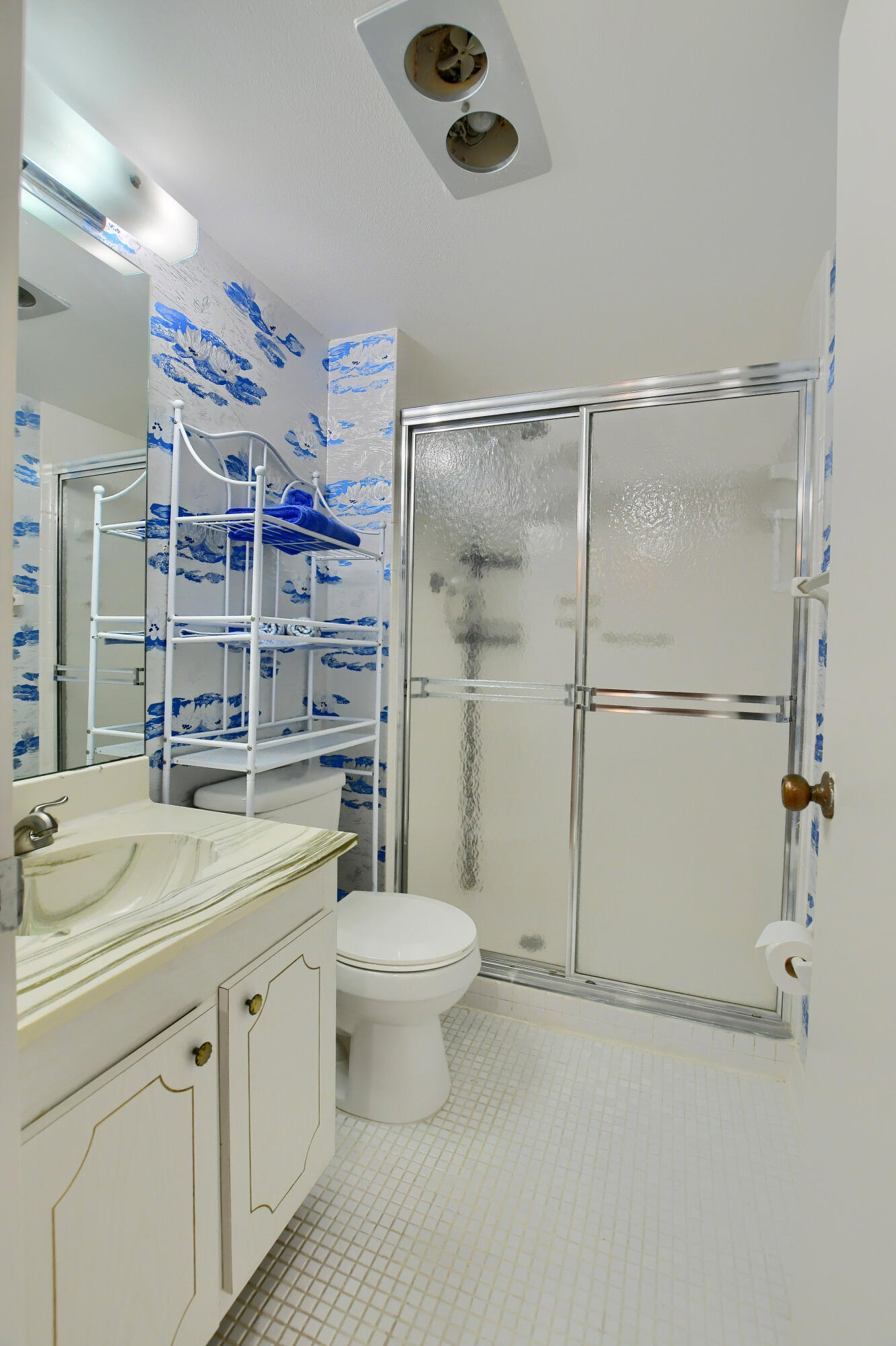 9826 Marina Boulevard, Unit 1027 Boca Raton, FL 33428 - Photo 14 of 25 a bathroom with a sink toilet and shower